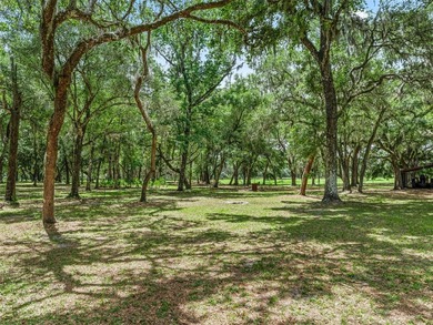 Tucked away behind a beautiful board-fenced entrance and paved - photo 45