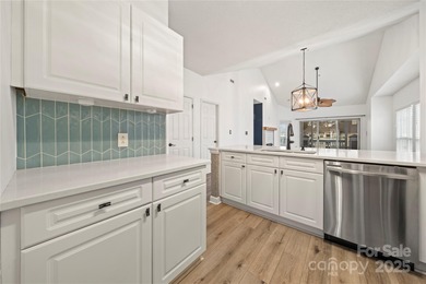 Don't miss this beautifully appointed end-unit condo with