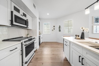 Absolutely stunning designer renovated condo in the heart of - photo 9