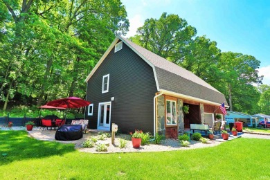 WOODS TO THE LEFT, LAKE TO THE RIGHT, A STYLISH HOME IN AN IDEAL - Lake Home For Sale in Monticello, Indiana