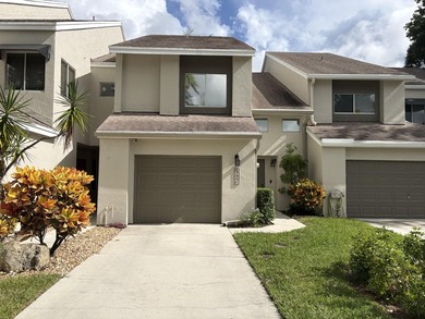 Nestled in the heart of Boca Raton, this two story townhome on a - photo 1