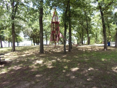Large 1.06 acre heavily wooded lot located in the gated - photo 11