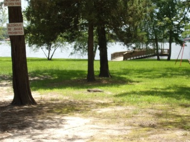 Large 1.06 acre heavily wooded lot located in the gated - photo 12