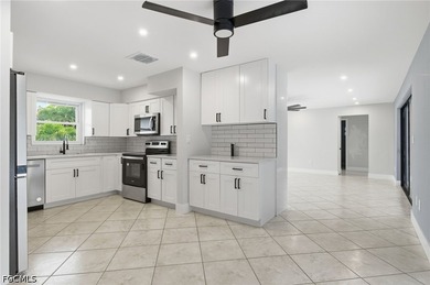 Welcome to this beautifully renovated pool home in the highly - photo 4