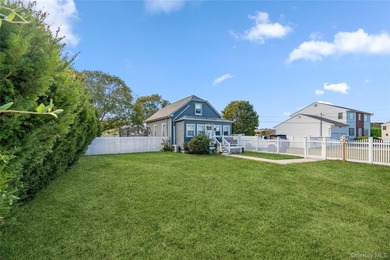 Welcome to 48 Farmers Avenue in Lindenhurst. A Charming and - photo 1