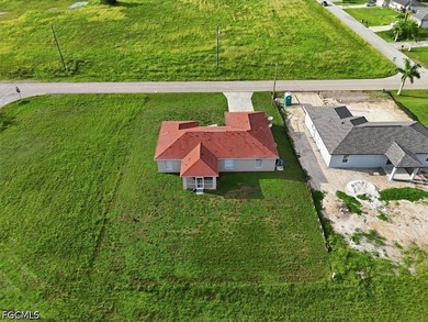 3-bedroom, 2-bath home offering an open-concept layout with tile - photo 6