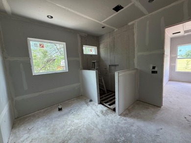 Spectacular views of the golf course from this new 3/2.5/3 home - photo 17