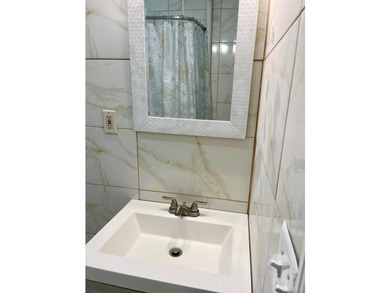Welcome to this well maintained and updated 2-unit brick home - photo 12
