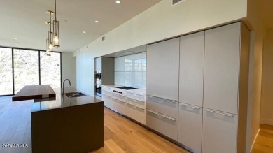 This 3 bedroom, 4 bath residence features an open concept