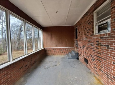 Solid built brick house that needs updating. Level lot with
