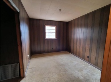 Solid built brick house that needs updating. Level lot with