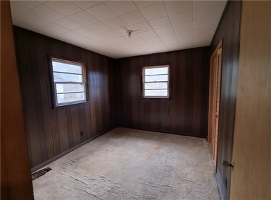 Solid built brick house that needs updating. Level lot with