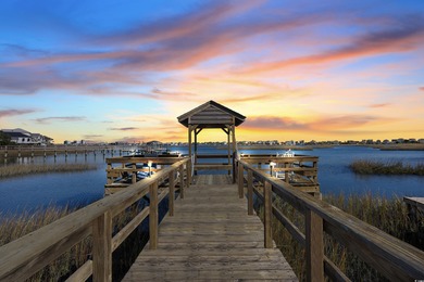 Wake up to sweeping marsh views, glowing sunsets, and the quiet