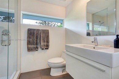 Located in Bay Heights, this 4-bedroom, 4.5-bath residence - photo 24