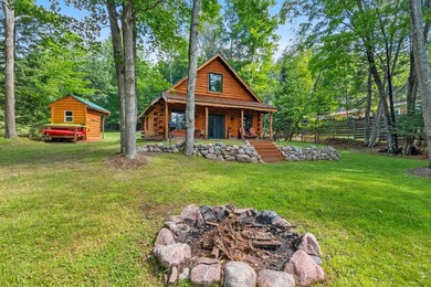 Experience true Northwoods living in this beautiful full log - photo 7