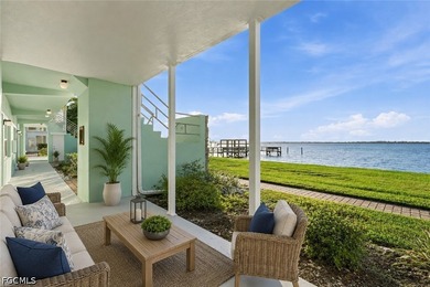 Discover serene riverfront living in this completely renovated - photo 1