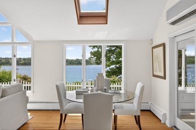 Set on a rare peninsula overlooking 27 acres of protected - photo 11