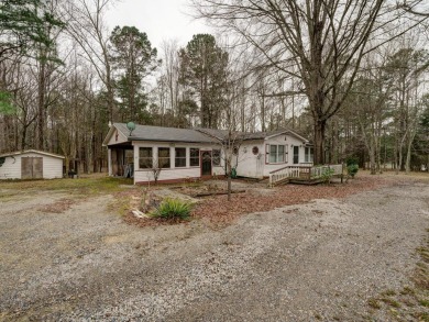 KERR LAKE BARGAIN boasts great water view & easy slope to the SOL - Lake Home SOLD! in Henderson, North Carolina
