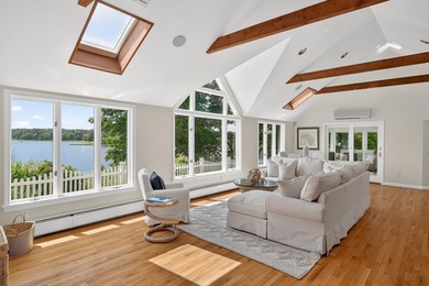 Set on a rare peninsula overlooking 27 acres of protected - photo 12