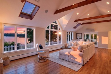 Set on a rare peninsula overlooking 27 acres of protected - photo 13