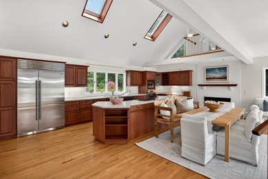 Set on a rare peninsula overlooking 27 acres of protected - photo 15