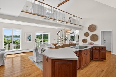 Set on a rare peninsula overlooking 27 acres of protected - photo 16