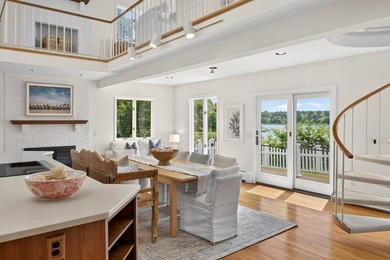 Set on a rare peninsula overlooking 27 acres of protected - photo 17