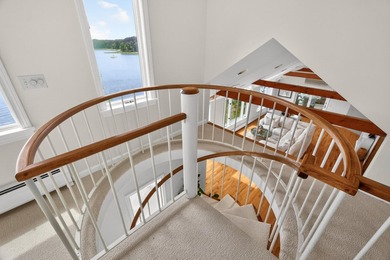 Set on a rare peninsula overlooking 27 acres of protected - photo 22