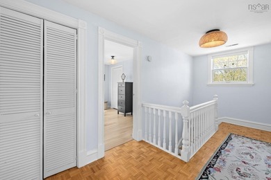 Set high on a quiet, tree-lined rise, 54 Parkhill Road feels - photo 22