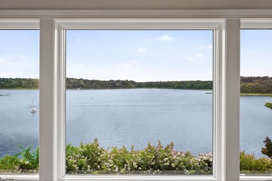 Set on a rare peninsula overlooking 27 acres of protected - photo 24