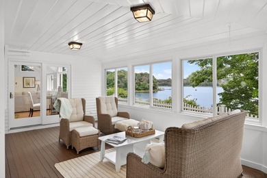 Set on a rare peninsula overlooking 27 acres of protected - photo 25