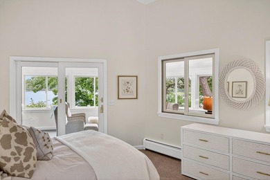 Set on a rare peninsula overlooking 27 acres of protected - photo 34