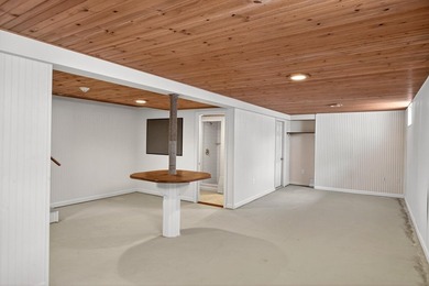 Set on a rare peninsula overlooking 27 acres of protected - photo 40