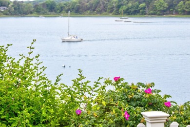 Set on a rare peninsula overlooking 27 acres of protected - photo 44
