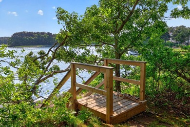 Set on a rare peninsula overlooking 27 acres of protected - photo 48