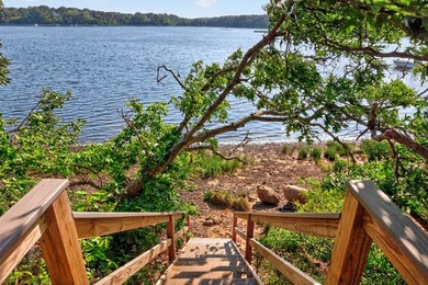 Set on a rare peninsula overlooking 27 acres of protected - photo 49