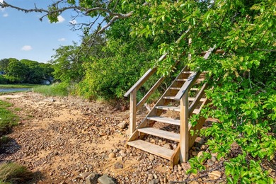 Set on a rare peninsula overlooking 27 acres of protected - photo 50