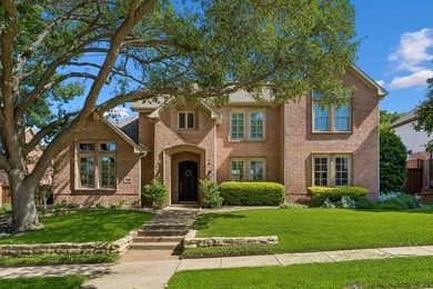 Welcome to this stunning two-story brick home nestled in the - photo 1