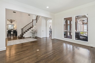 Welcome to this stunning two-story brick home nestled in the - photo 3