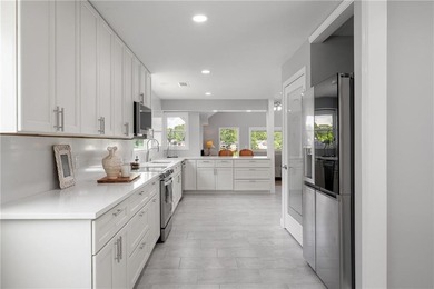 Few homes capture the essence of luxury lake living quite like - photo 21
