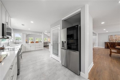 Few homes capture the essence of luxury lake living quite like - photo 22
