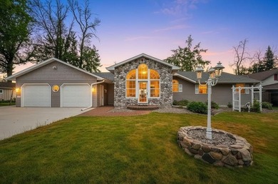 Beautiful arched-window entry welcomes you to this inviting lake - photo 1