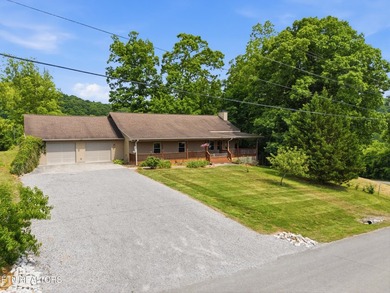 Escape to the serenity of the Holston River with this stunning - photo 2