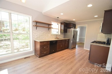 Improved pricing! Welcome to this 1.5-story home offering both - photo 12