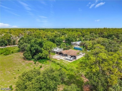 Nestled on just over an acre in North Fort Myers, this charming - photo 1