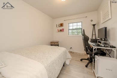 This spacious 4-bedroom, 2-bathroom home offers a warm and - photo 12