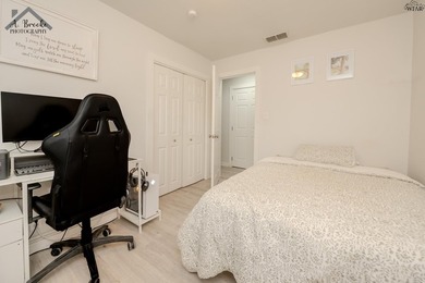 This spacious 4-bedroom, 2-bathroom home offers a warm and - photo 13