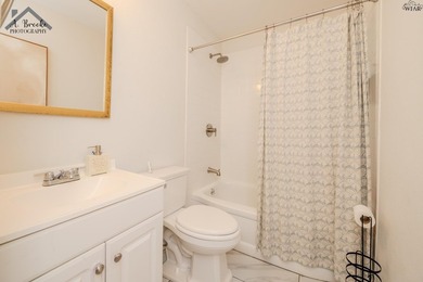 This spacious 4-bedroom, 2-bathroom home offers a warm and - photo 14