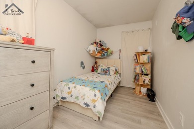 This spacious 4-bedroom, 2-bathroom home offers a warm and - photo 18
