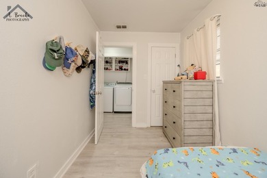 This spacious 4-bedroom, 2-bathroom home offers a warm and - photo 19